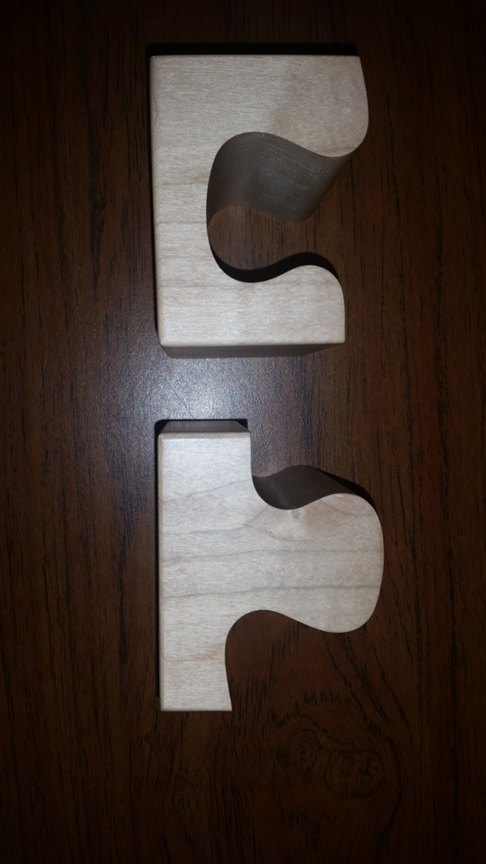 Puzzle-shaped lamp base that was CNC machined from soft maple wood.