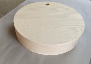 Laminated ash lamp base with clean cylindrical form, CNC routed and drilled for hardware installation.