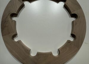 CNC-routed walnut ring assembled with Festool domino joinery and precision-drilled cutouts.