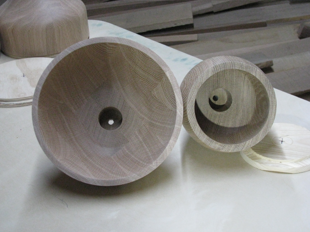 Turned wood pendant shade blanks with internal boring for hardware installation.