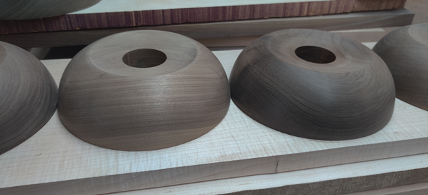 Solid Walnut Lighting Canopies CNC Routed and Turned Rounded solid walnut lighting canopies with center bores, CNC routed and turned to shape.