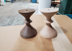 Pair of turned lamp bases made from laminated walnut and hard maple with sculpted hourglass profiles.