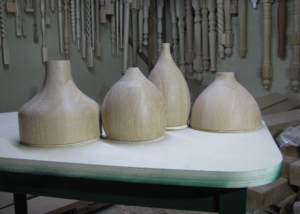 Laminated and turned white oak pendant shades in various profiles, unfinished and ready for hardware.
